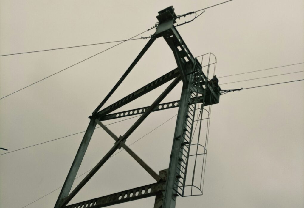 a close up of a power line with a sky background
