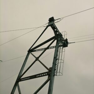 a close up of a power line with a sky background